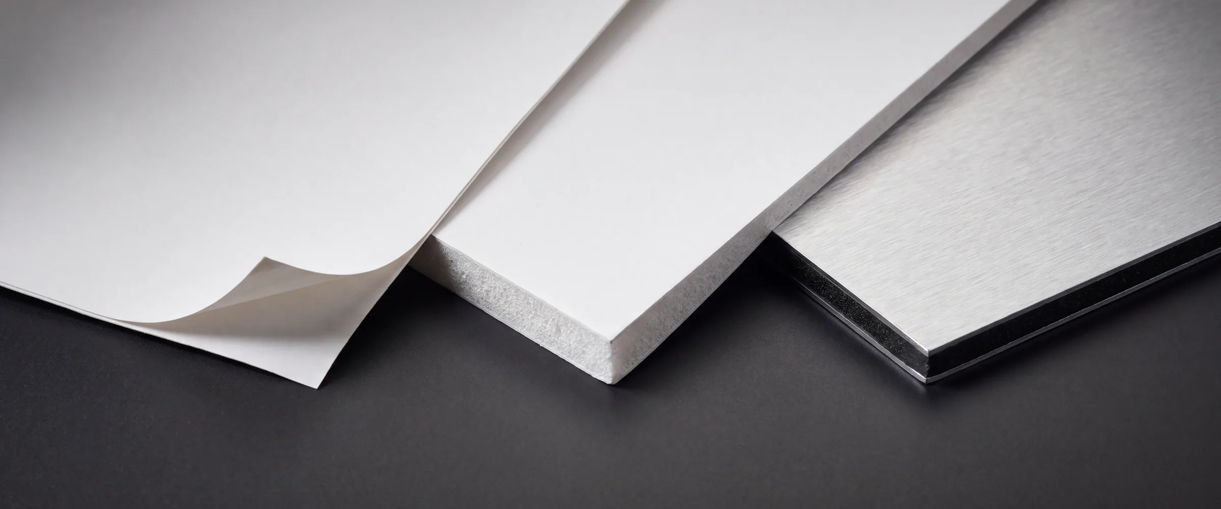 Vinyl, rigid PVC and aluminium composite sign substrates shown at the cut edge